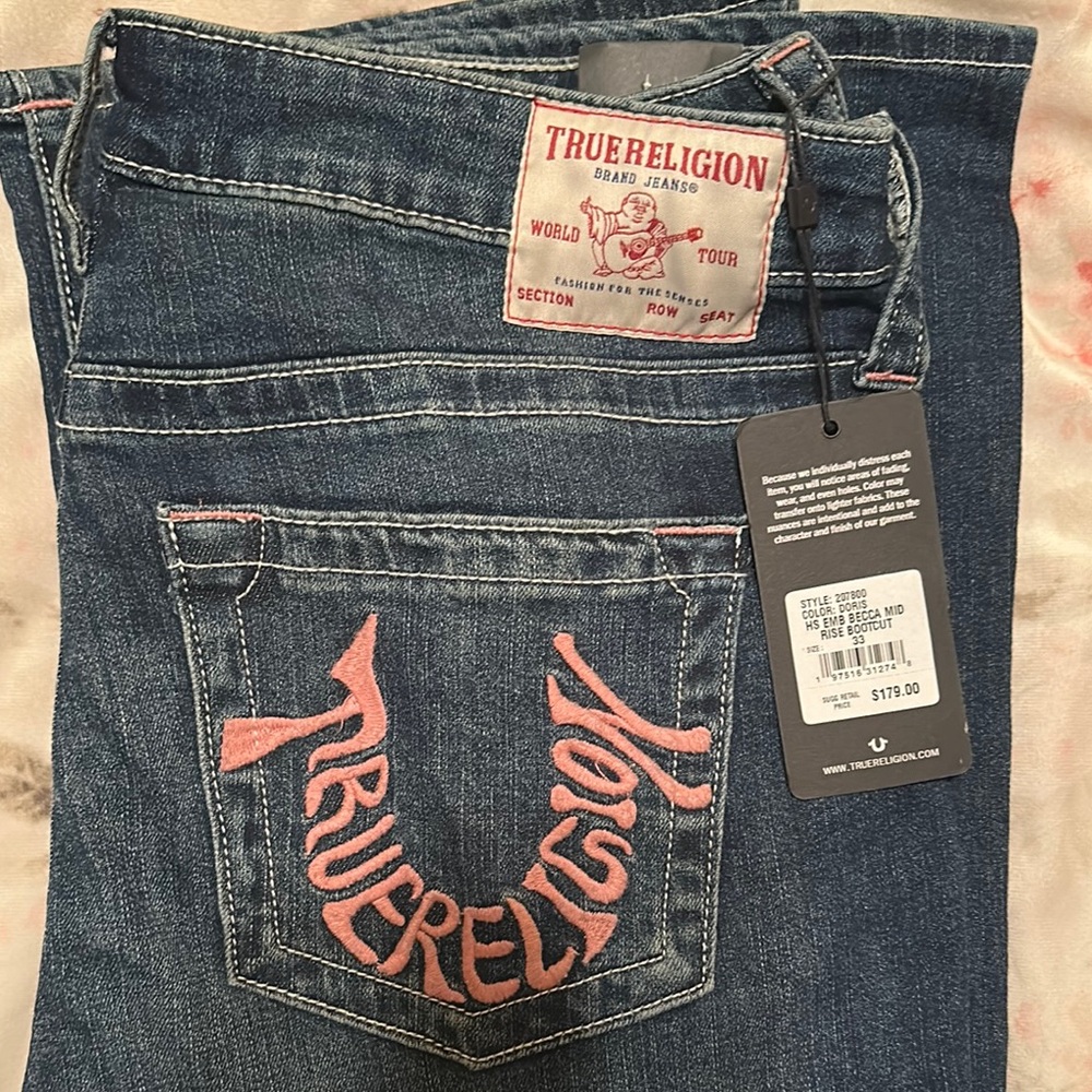 True Religion Blue Jeans with Signature Pink/Red Stitching. Brand new with tags!